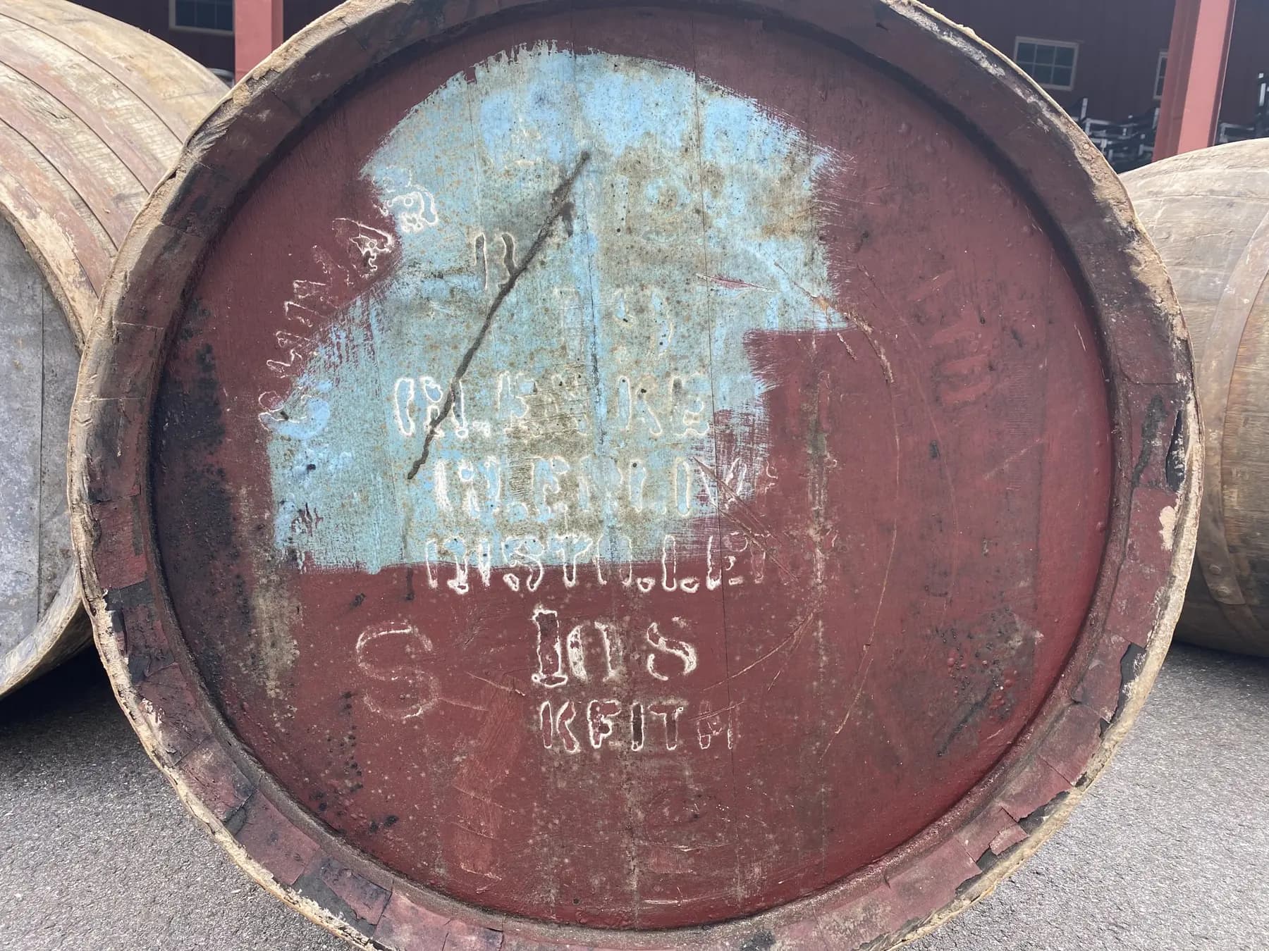 The cask end: a 1970 Speyside cask, its stencils worn into red and blue paint